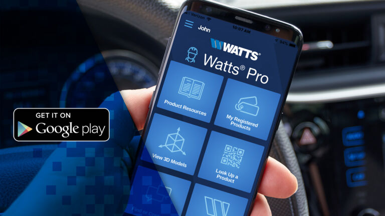 The Watts Pro app's home screen being displayed on a phone next to a 