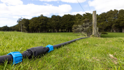 APEX Connector shown on ground in a field, connecting houses together. 