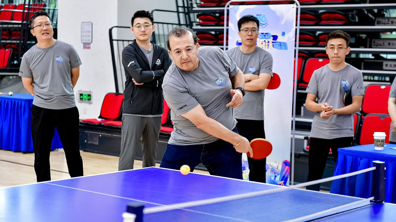 Watts APMEA employees participating in a ping pong tournament